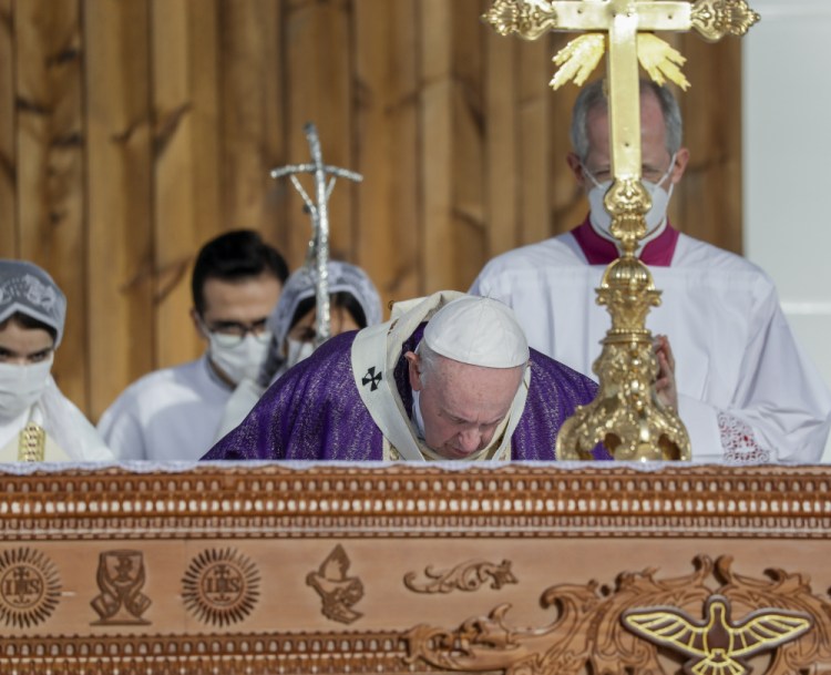 Pope Francis celebrates mass Sunday at the Franso Hariri Stadium in Irbil, Kurdistan Region of Iraq.