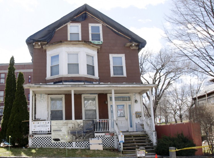 Signs call attention to the house where slain African-American leader Malcolm X spent part of his childhood in the Roxbury neighborhood of Boston. According to the National Park Service the house was added to the National Register of Historic Places in February. 