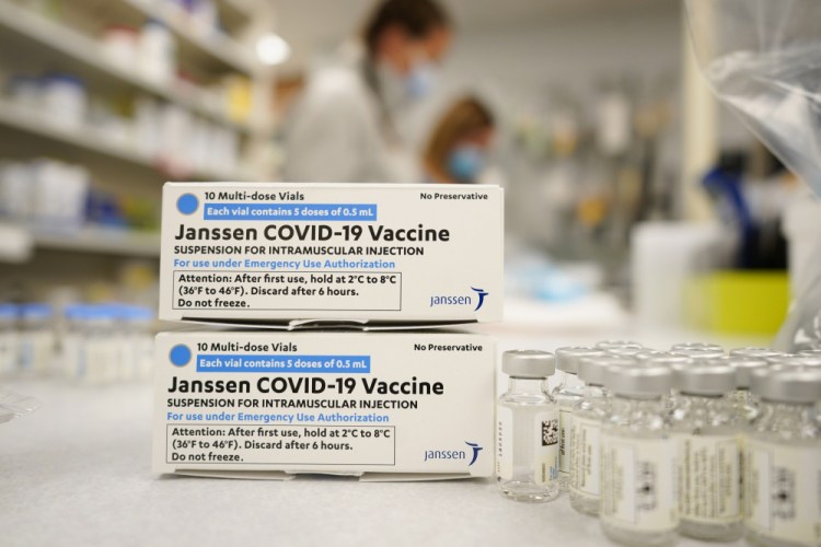 Boxes stand next vials of Johnson & Johnson COVID-19 vaccine in the pharmacy of National Jewish Hospital for distribution in Denver. 