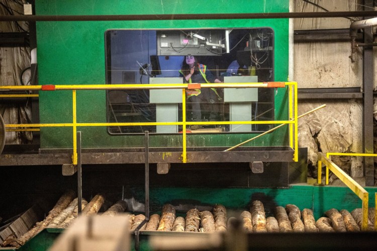 JACKMAN, MAINE- MAY 10, 2021
Keri Libby (cq) sits in the operator's cockpit of the debarked at Moose River Lumber in Jackman on Monday, May 10, 2021. (Staff Photo by Michael G. Seamans/Staff Photographer)