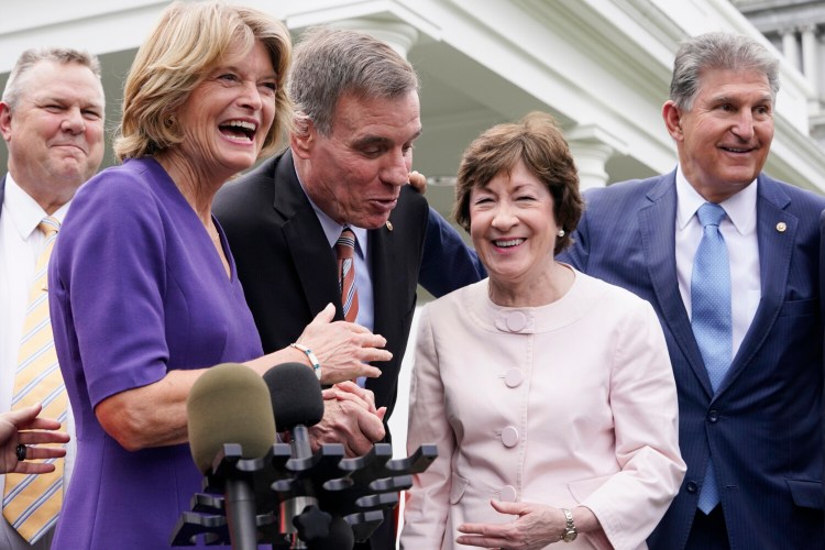 From left, Sen. Jon Tester, D-Mont., Sen. Lisa Murkowski, R-Alaska, Sen. Mark Warner, D-Va., Sen. Susan Collins, R-Maine, and Sen, Joe Manchin, D-W.Va., speak to the media after remarks by President Joe Biden, Thursday June 24, 2021, at the White House in Washington. Biden invited members of the group of 21 Republican and Democratic senators to discuss the infrastructure plan. (AP Photo/Jacquelyn Martin)