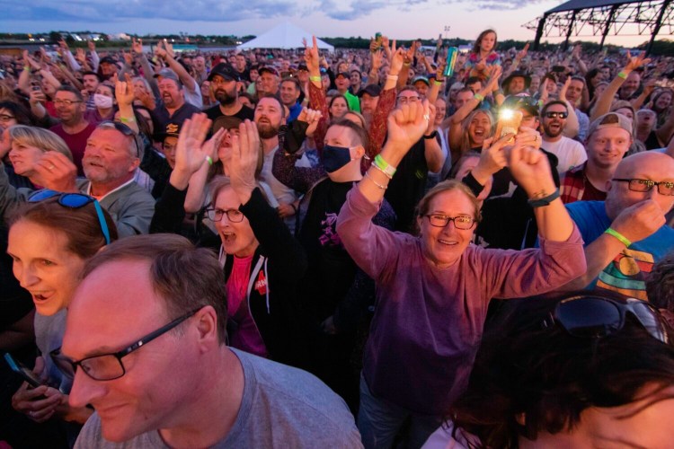 Concertgoers cheer for Nathaniel Rateliff and the Night Sweats at Thompson's Point in Portland in 2021.