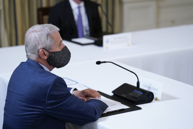 Dr. Anthony Fauci, director of the National Institute of Allergy and Infectious Diseases, listens as President Biden receives a briefing on Tuesday on how the pandemic is impacting hurricane preparedness. “If it turns out as the data come in, we see we do need to give an additional dose to people in nursing homes ... or people who are elderly, we will be absolutely prepared to do that very quickly,” Fauci said Sunday.