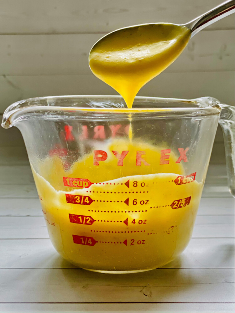 Green Plate Special: Minute Hollandaise spooned from a measuring cup. (Photo by Christine Burns Rudalevige)