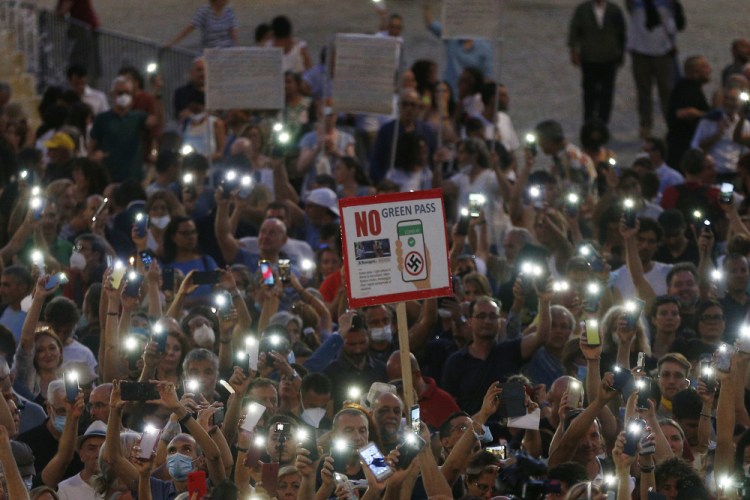 People stage a protest against the COVID-19 vaccination pass in Rome on July 28. Despite the resistance, vaccine demand in Italy increased by as much as 200 percent in some regions after the government announced the Green Pass, according to the country's special commissioner for vaccinations.