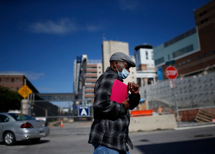 PORTLAND, ME - SEPTEMBER 2: A man walks on Gilman Street in Portland on Thursday. (Davis/Staff Photographer)