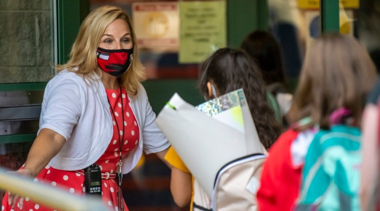 Principal Heather Gauthier welcomes students on the first day of school on Sept. 1 at Lincoln Elementary School in Augusta.