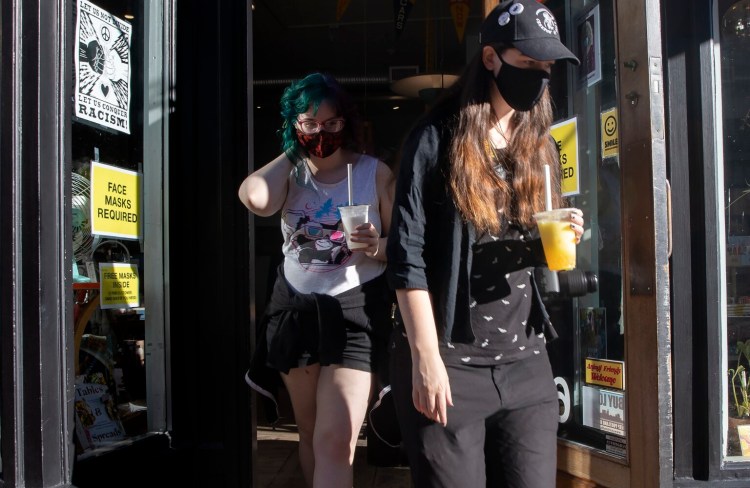 PORTLAND, ME - SEPTEMBER 7: Elise Smorczewski, right, and Megan Turner, both of Portland, walk out of Pinecone+Chickadee on Free Street on Tuesday. (Photo by Derek Davis/Staff Photographer)