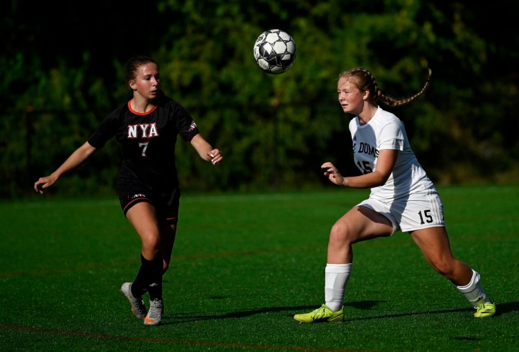 YARMOUTH, ME - SEPTEMBER 14:  North Yarmouth Academy's Michala Wallace battles for a loose ball with Saint Dominic Academy's Avery Gravel Tuesday, September 14, 2021. (Staff Photo by Shawn Patrick Ouellette/Staff Photographer)