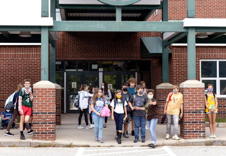 Students leave Bonny Eagle Middle School at the end of the day on Friday. The school, with 800 students, has seven cases of COVID-19.