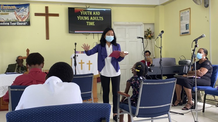 In this 2021 photo provided by Global Ministries, Global Mission Fellow Wingamkamliu Rentta leads youth and young adults in St. Lucia, during her service with the Methodist Church in the Caribbean and the Americas.  The International Mission Board is requiring its missionaries get the COVID-19 vaccine. The board is a Southern Baptist Convention agency and deploys thousands of evangelical missionaries across the globe. 