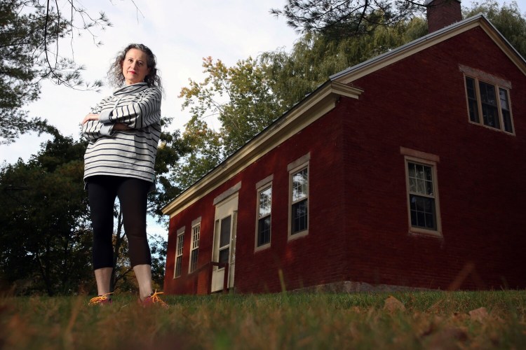 FAIRFIELD, ME - OCTOBER 11: Veronique Plesch's home is next to fields where sludge was spread over the years. Thanks to a recently passed law, her drinking water's contamination level qualified her for a filtration system for her home. The state budget passed earlier this summer contains $30 million for the Maine DEP and DACF to test more than 500 sites statewide that received municipal sludge, or biosolids, for use as fertilizer. (Staff photo by Ben McCanna/Staff Photographer)
