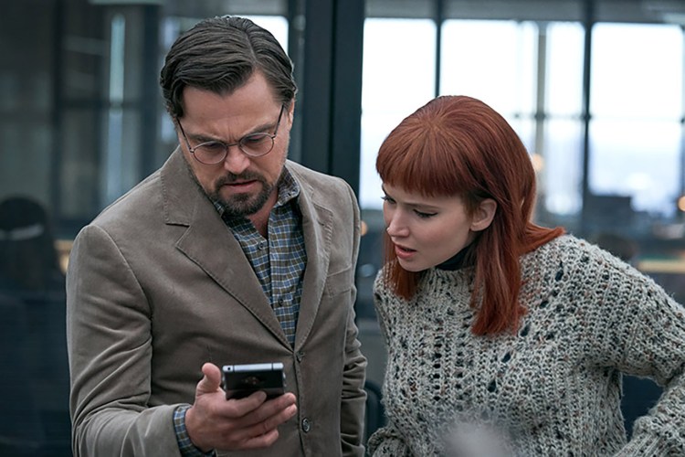 Leonardo DiCaprio, left, and Jennifer Lawrence in “Don’t Look Up.” MUST CREDIT: Niko Tavernise/Netflix