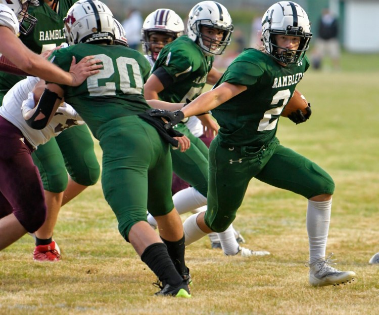 Winthrop/Monmouth/Hall-Dale running back Robby Feeney runs the ball during a football game against Foxcroft on Friday in Winthrop. 