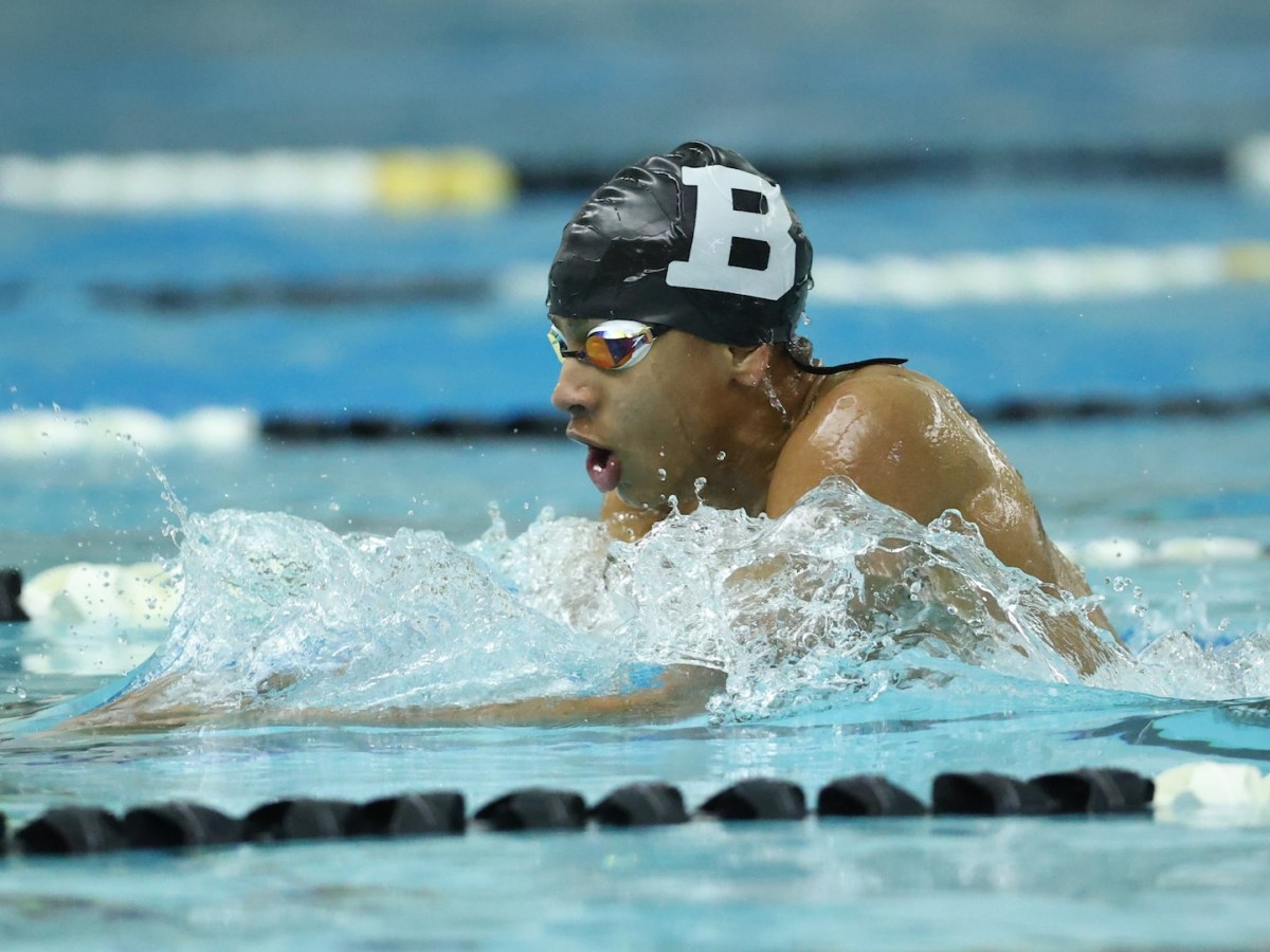 Alexandre Grand'Pierre swims for Bowdoin in a meet against Colby College.